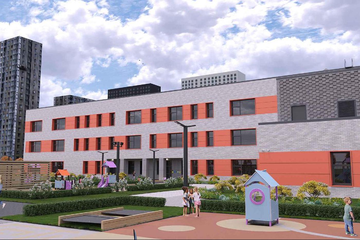 Фасады здания выполнены в контрастных серых оттенках. Зоны оконных проёмов и межоконное пространство украсили вставки насыщенного оранжевого цвета.